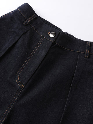 Close-up: black/dark wash elastic waistband with metal button and loops.
