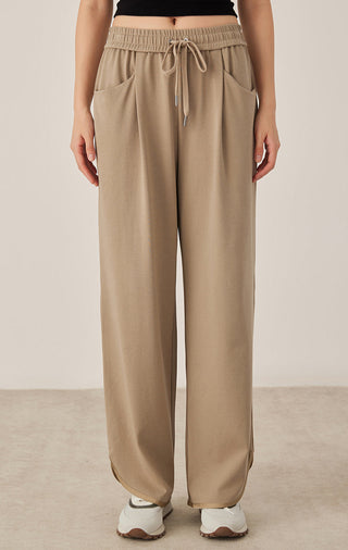 Khaki relaxed fit drawstring pants with elastic waistband, wide straight legs