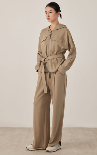 Khaki relaxed fit drawstring pants with elastic waist and wide legs; side pockets