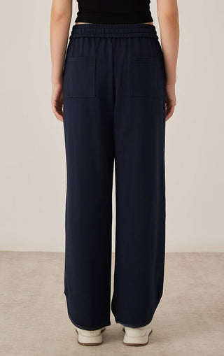 Dark blue wide-leg drawstring pants with two back patch pockets and elastic waist