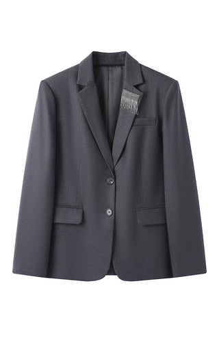 Tailored wool-blend blazer in grey, front view with button closure, pockets, and shimmer fringe detail.