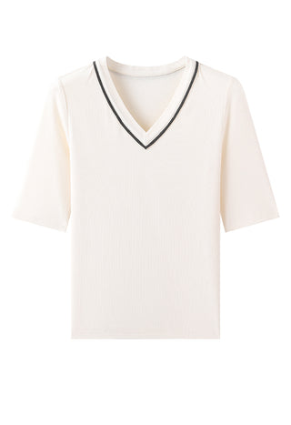 White short-sleeve V-neck knit top with black trim, textured weave