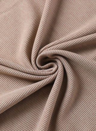 Close-up knit texture of brown ribbed fabric for V-neck top