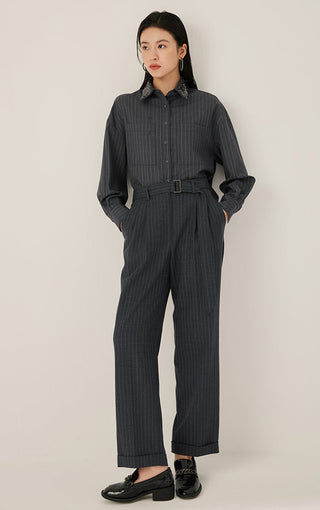 Dark gray pinstripe wool belted pleated pants with straight leg and rolled cuffs