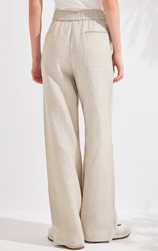Beige high-waisted wide-leg trousers with patch pockets at front