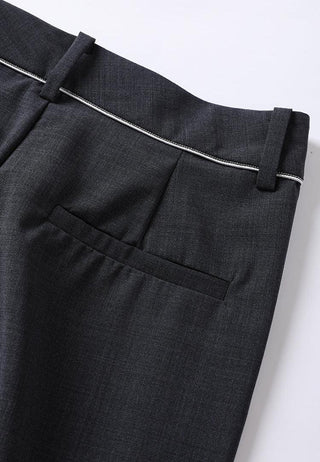 Black wide-leg pants front close-up with belt loop, contrast piping, and side pocket