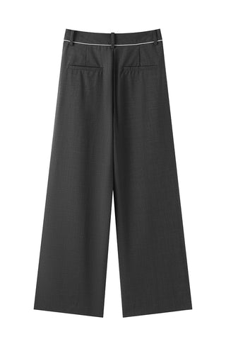 Black wide-leg tailored pants flat lay, front view with pockets and center crease