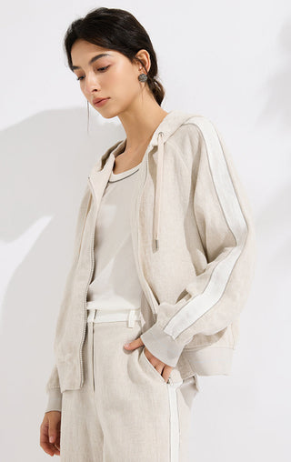 Beige linen hooded jacket with relaxed sleeves, zip front, and hood drawstrings