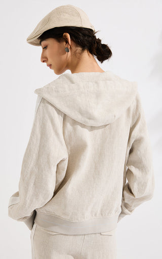 Beige linen hooded jacket back view with draped hood and relaxed loose fit