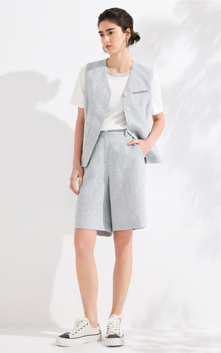 Light blue linen-blend tailored vest worn with matching shorts