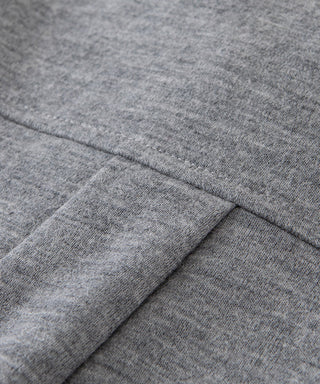 Heather grey wool blouse fabric close-up with stitched seam