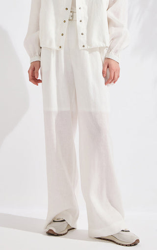 White linen wide-leg pants with gathered waistband and pleated front