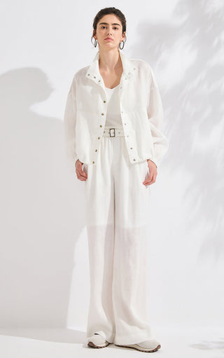 White linen wide-leg pants with metal buckle belt, full-length relaxed fit