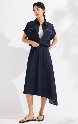 Denim blue midi skirt with elastic waist and asymmetric overlay, flowing drape