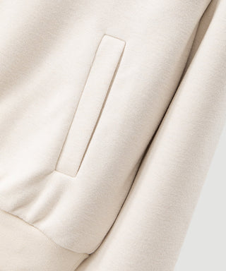 Oatmeal wool-blend pullover chest pocket detail with clean stitched edges