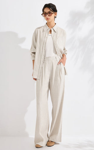 Beige striped relaxed wide-leg pants with vertical pinstripes and elastic waist