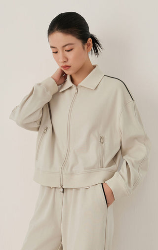 Oatmeal zip-front bomber-style jacket with two vertical zippers and ribbed collar