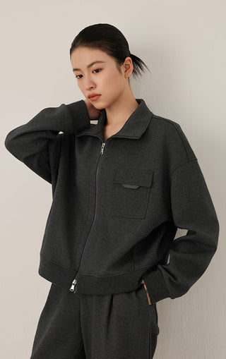 Dark gray zip jacket with stand collar, chest pocket, and ribbed cuffs