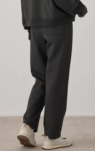 Dark gray straight-leg pants with back seam detail and side pocket openings