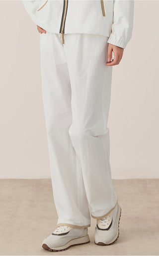 Women’s relaxed drawstring waist pants in white, wide leg with front pockets