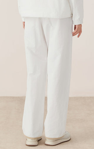 Women’s white relaxed drawstring waist pants, wide straight legs with elastic waistband