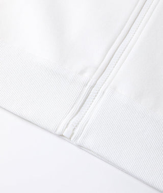 White zip-up hoodie cuff with ribbed trim and seam detail