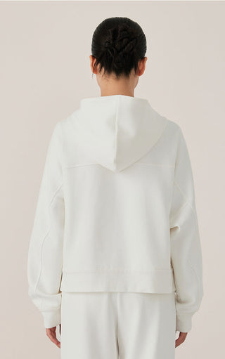 White zip-up hoodie back view with hood and roomy relaxed fit.