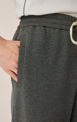 Gray textured lounge pants with drawstring waist and side pocket patch