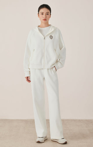 White women’s relaxed lounge pants with elastic waist and wide leg silhouette