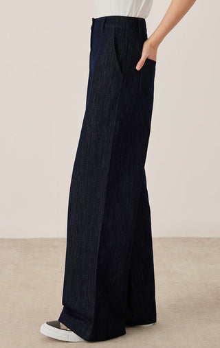 Black wide-leg tailored pants with side seams and floor-length relaxed leg opening