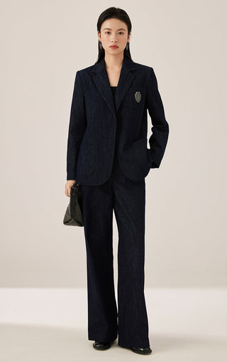 Black wide-leg tailored pants with straight waistband and draped full-length legs