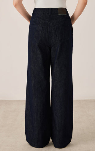 Black wide-leg tailored pants, back view with center seam and full-length drape