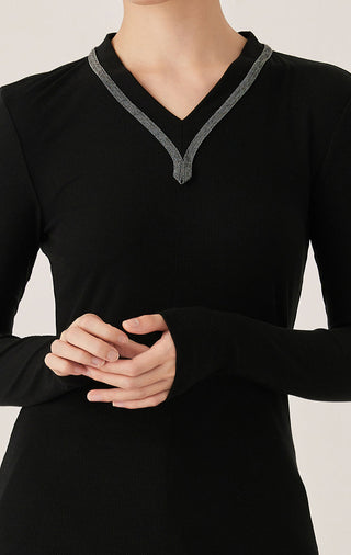 Black ribbed V-neck top with contrast trim and small beaded detailing