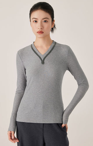 Gray ribbed long-sleeve top with V-neck and dark trim