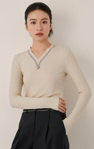 Oatmeal ribbed V-neck top with contrast trim and long sleeves