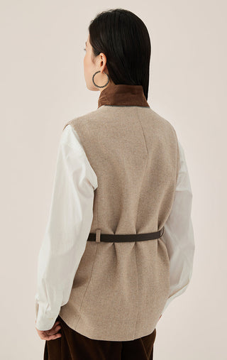 Back view of beige belted wool-blend vest with black belt and tailored seam lines
