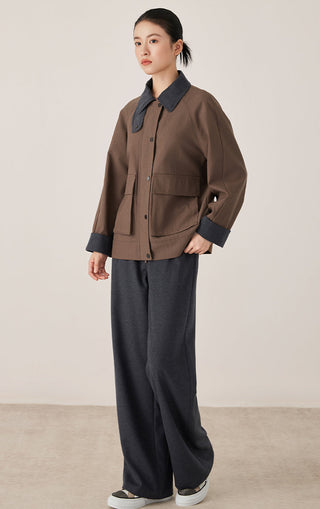 Brown stand-collar jacket with button front, flap pockets and cuffed sleeves