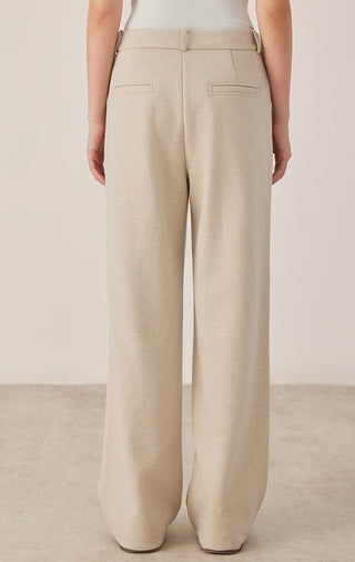 Khaki/beige wide-leg pants with relaxed fit, belt loops, and side pockets.