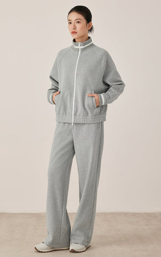 Gray-blue wide-leg pants on model, easy drape, belt loops, and side pocket detail.