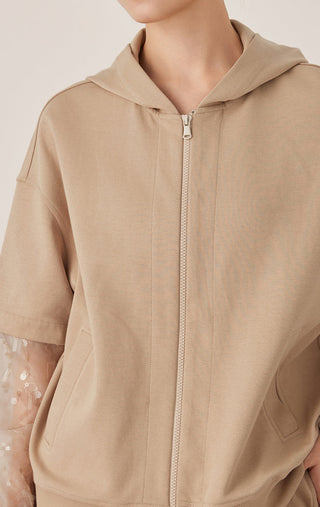 Khaki zip hooded jacket close-up: adjustable hood and zipper, sheer mesh sleeve detail