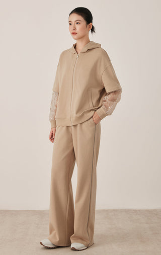 Khaki zip hooded jacket with sheer patterned mesh sleeves, full outfit view