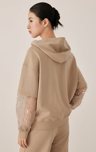 Khaki zip hooded jacket, back view with hood and sheer patterned mesh sleeve cuffs