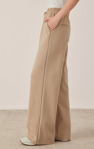 Khaki wide-leg pants with elastic waist, drawstring, and front patch pocket