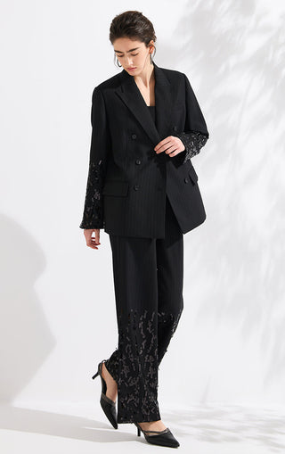 Black pinstripe double-breasted blazer with sequined sleeves, tailored fit
