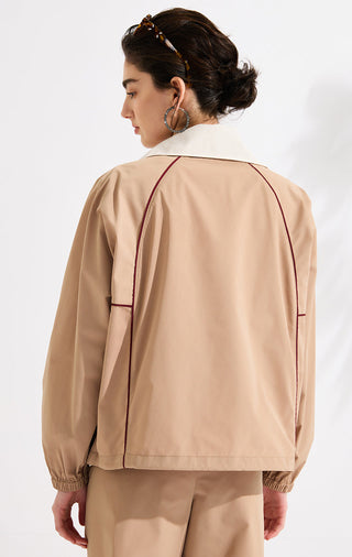 Back view of khaki zip track jacket with dark red contrast trim and elastic cuffs