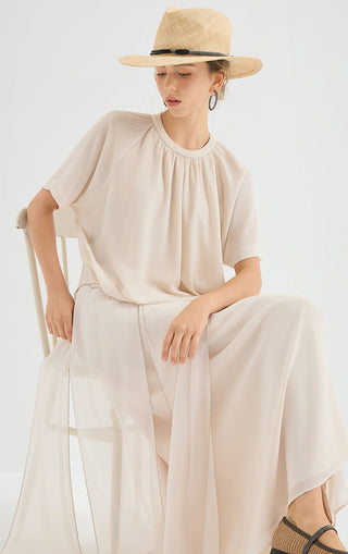 White chiffon blouse front view with gathered neckline and airy short-sleeve drape