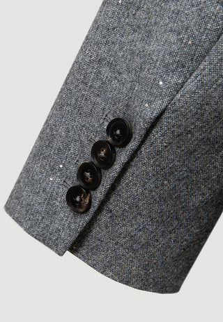 Grey double-breasted blazer sleeve with cuff buttons and textured woven fabric