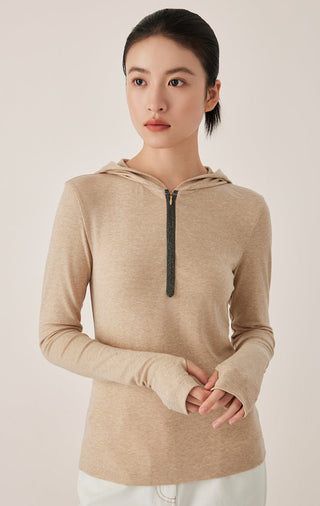 Camel half-zip hooded top with beaded trim along the zipper and long sleeves