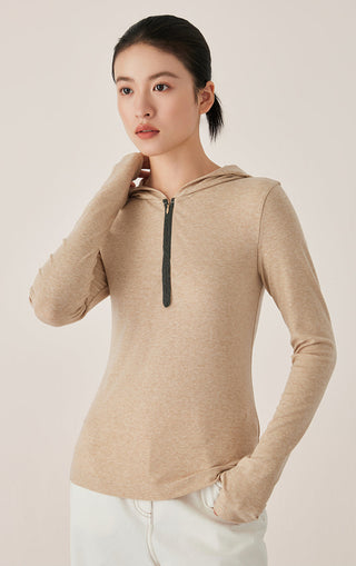 Camel half-zip hooded top with beaded zipper detail and long sleeves, front view