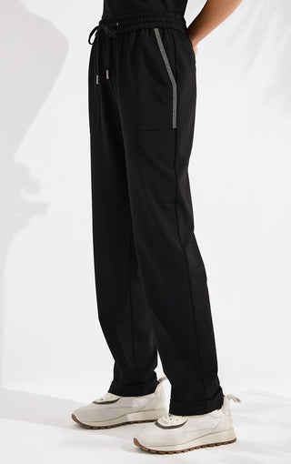 Black wide-leg cotton pants with drawstring ties and silver beaded side stripe